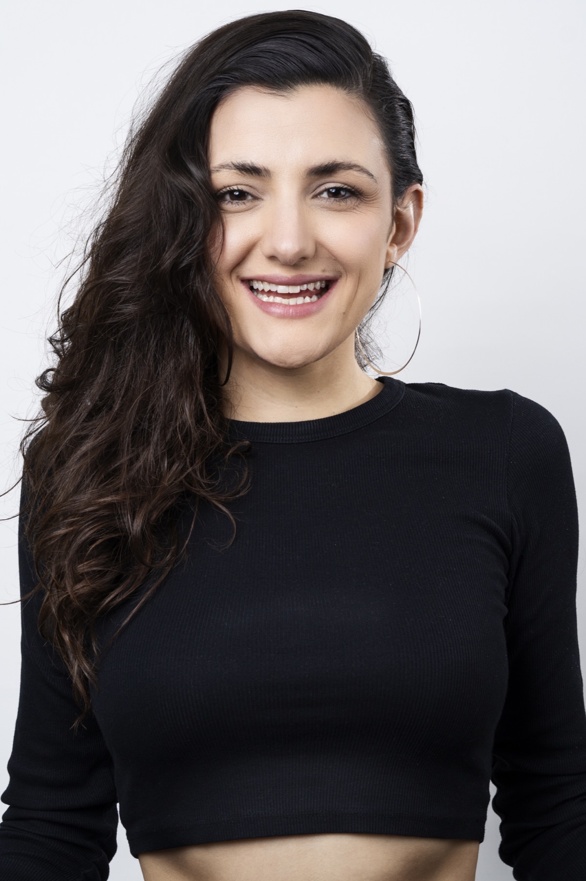 Friendly promotional headshot of solo artist Emily Rault