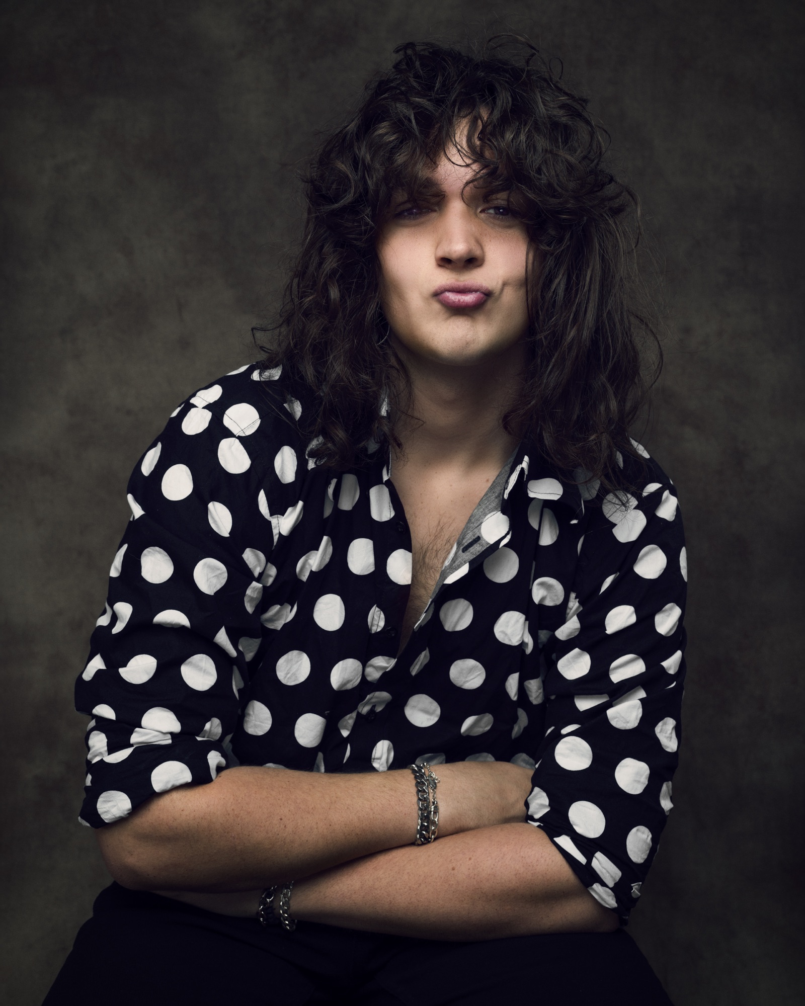 Close studio portrait of musician Markus Inkster in a black and white polka dot shirt