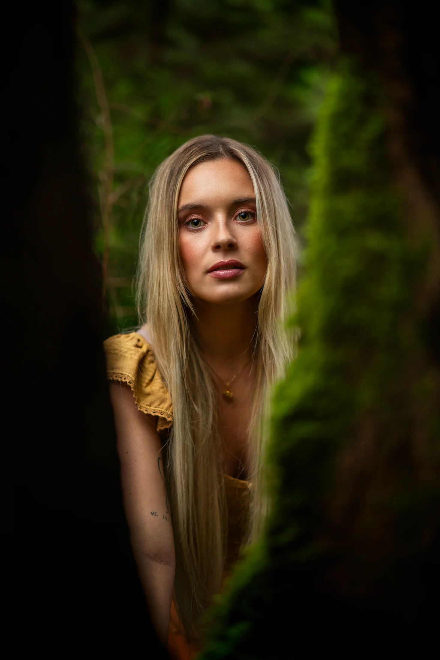 Camille Felton framed by trees and moss