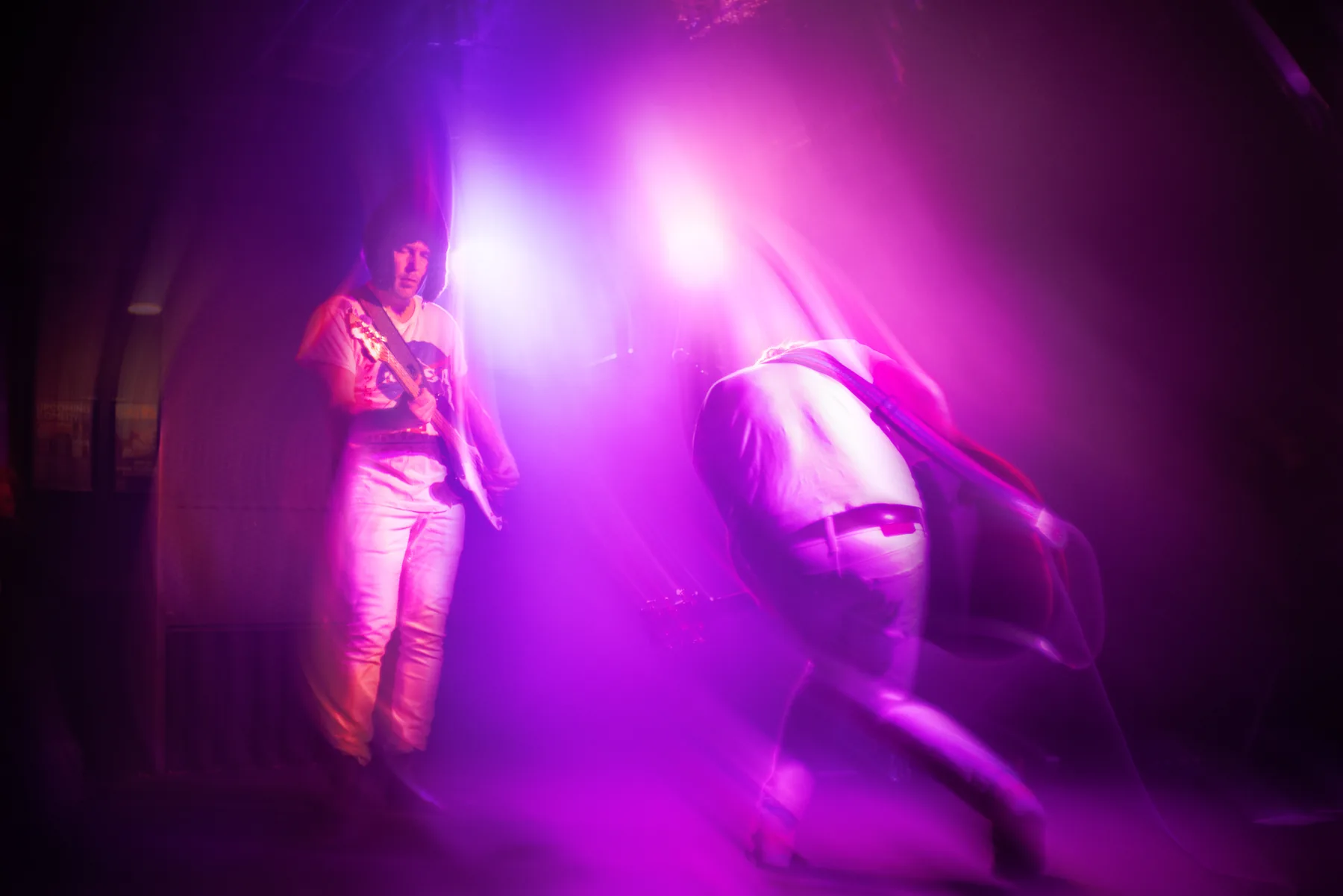Live musician performing under colourful event lighting in Vancouver