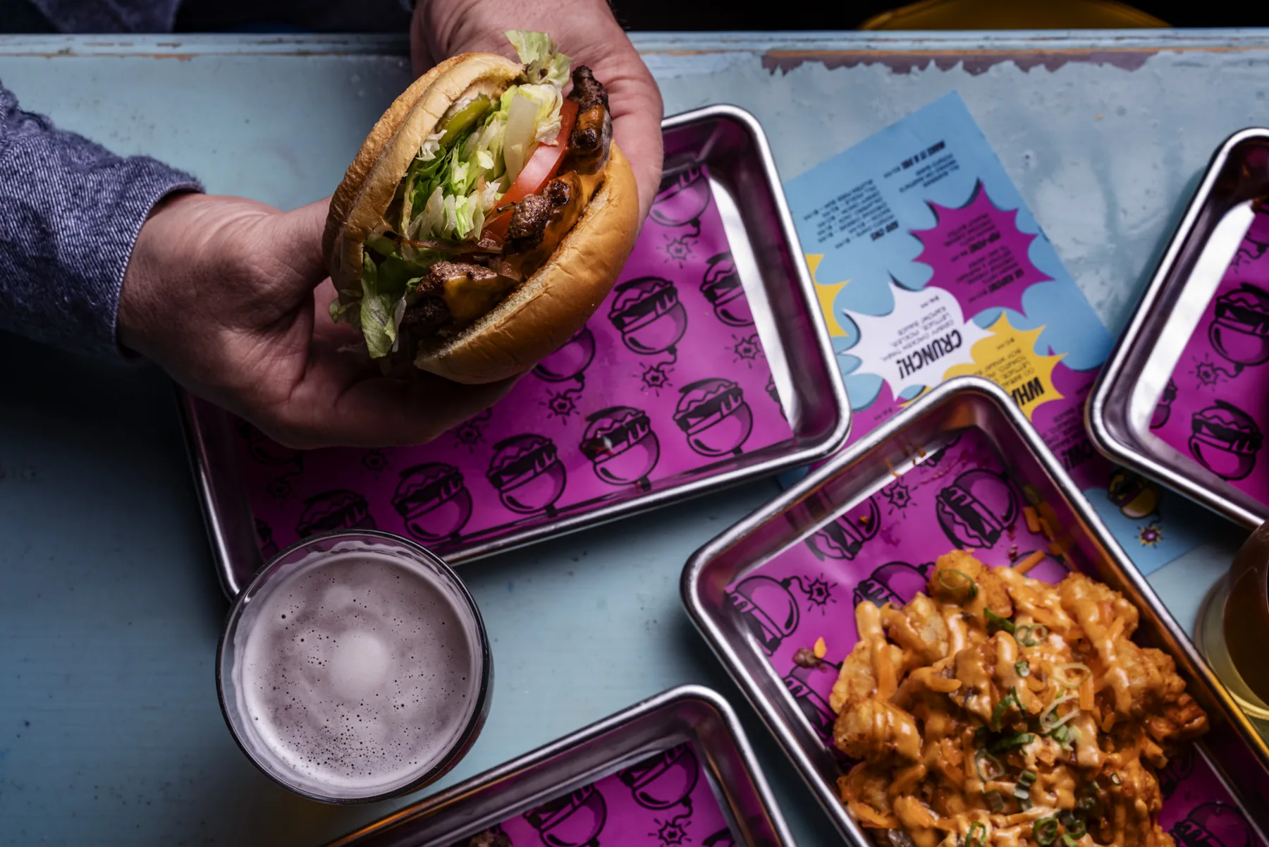 Colourful food delivery containers photographed for a restaurant brand