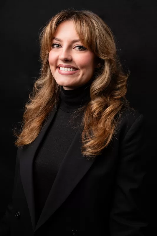 Promosa team member in a black blazer