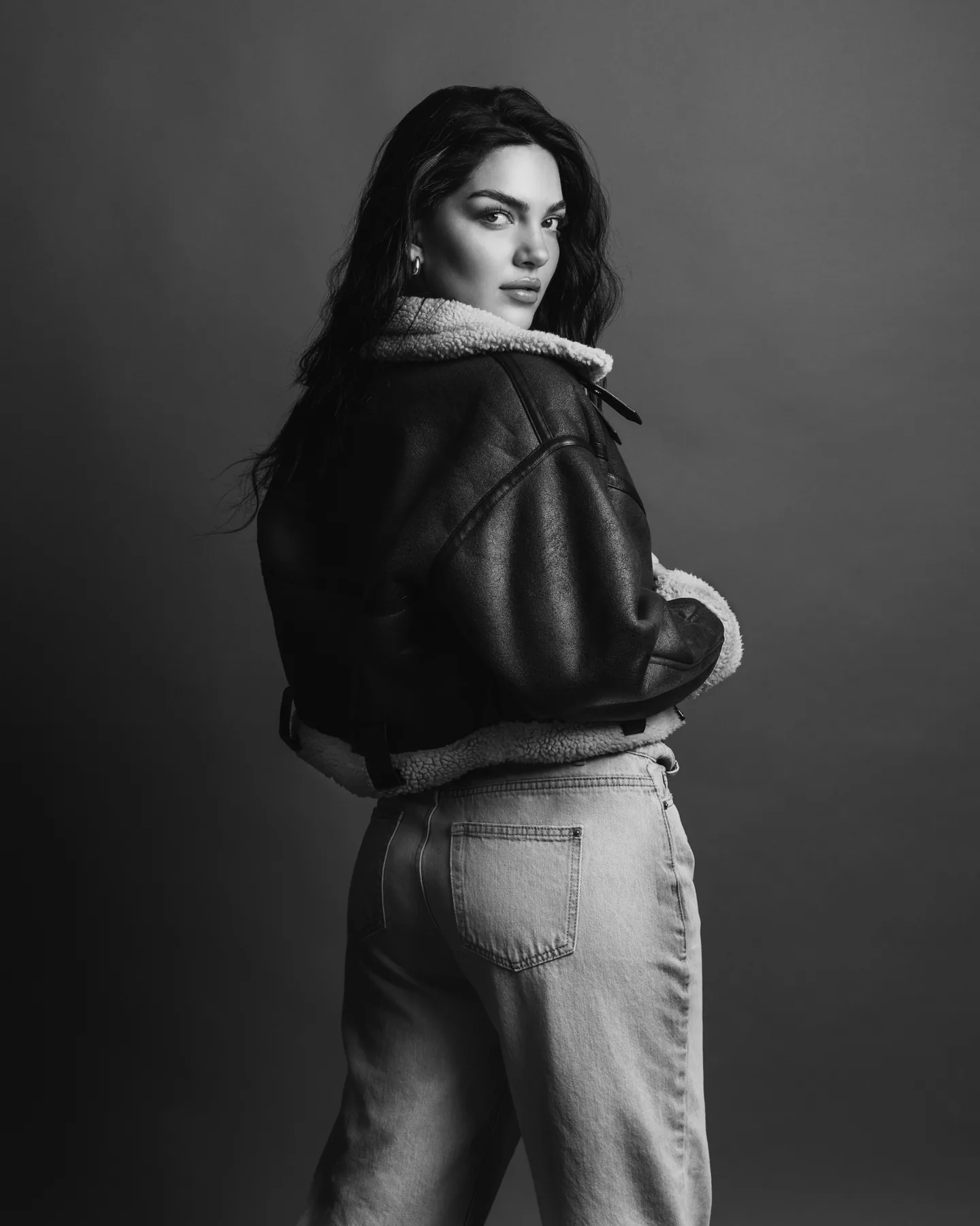 Black and white fashion portrait with sculptural styling and natural expression