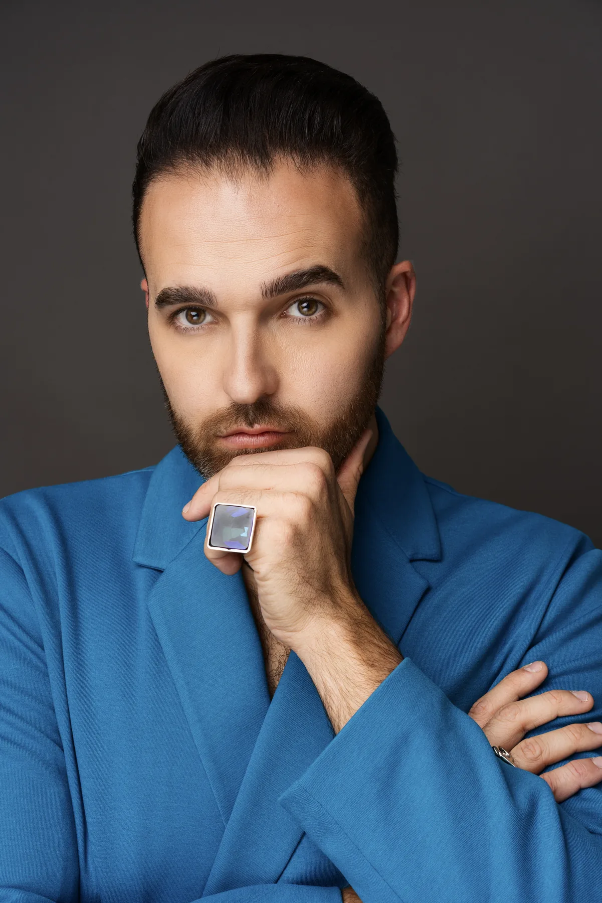 Close personal branding portrait of a man in a blue suit