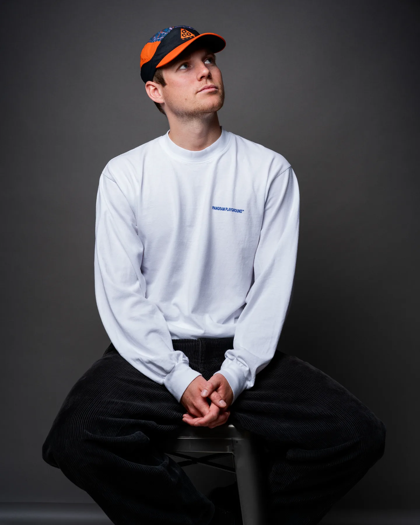 Casual seated personal branding portrait photographed in a Vancouver studio