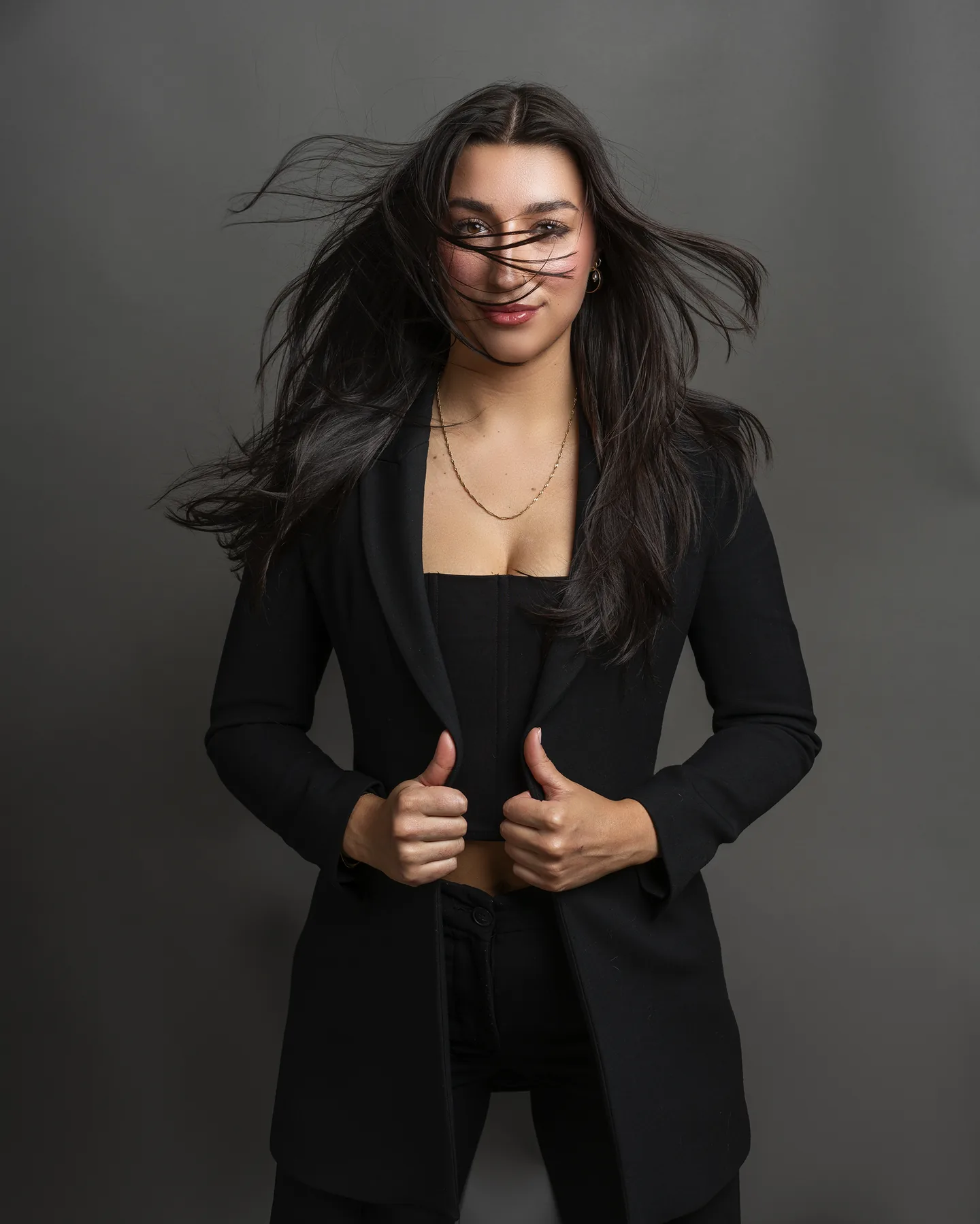 Personal branding portrait of a Vancouver professional wearing a black suit